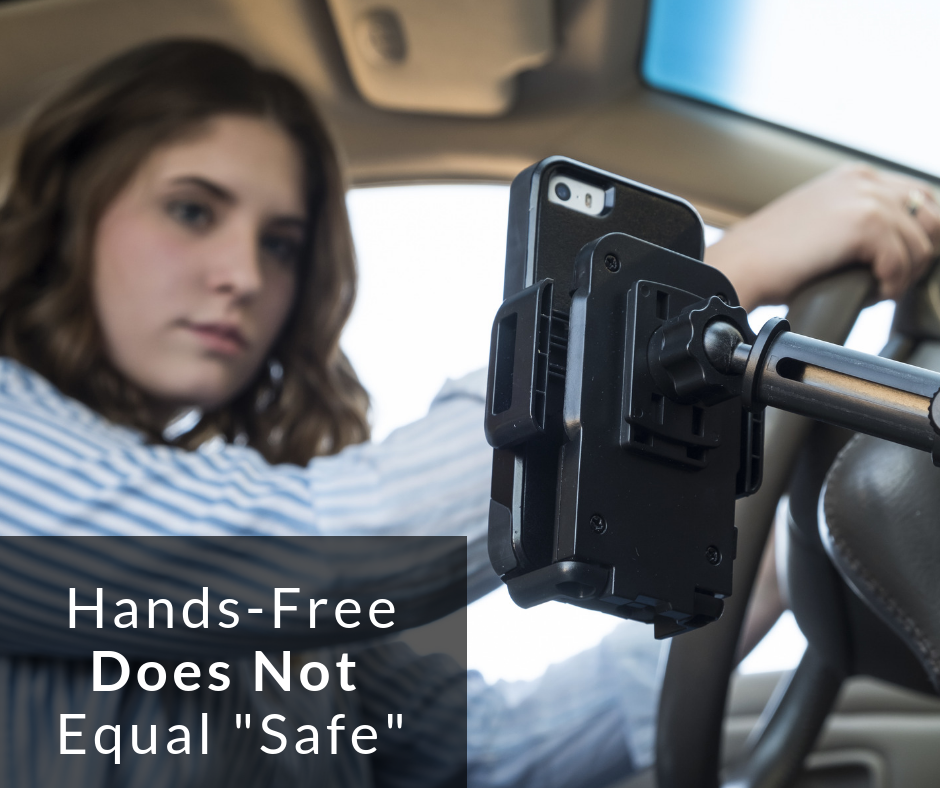 Woman Looking at Phone Instead of the Road