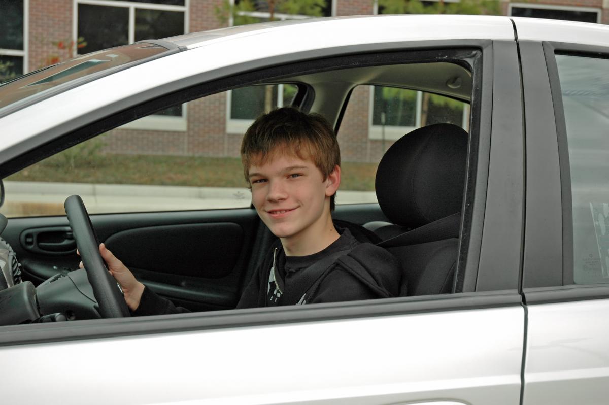 Teen Driver Smiling at Camera
